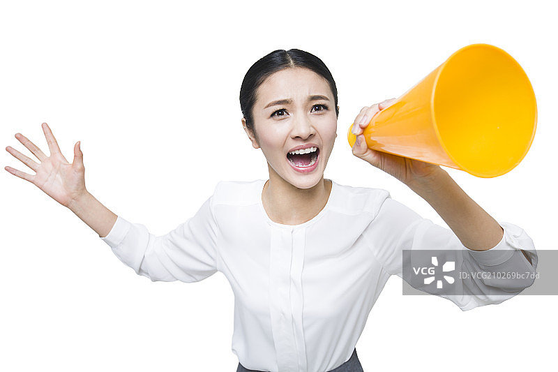 年轻女子拿着喇叭大喊图片素材