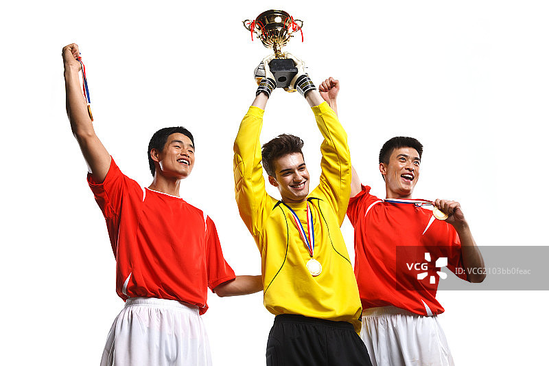 运动员高举奖杯图片素材