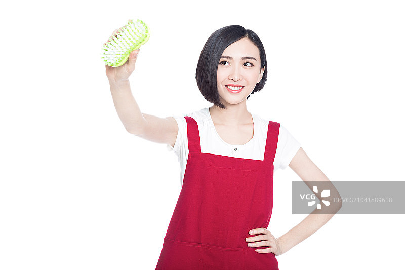 青年女性手拿清洁海绵图片素材