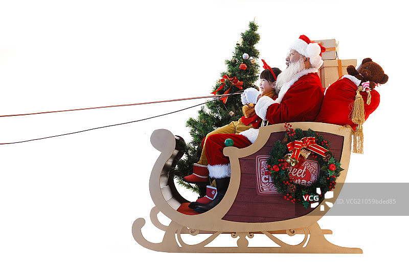 圣诞老人和小女孩坐在雪橇上图片素材