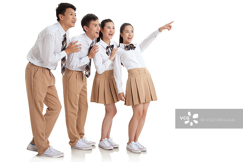 四个中学生惊奇的向侧面看图片素材