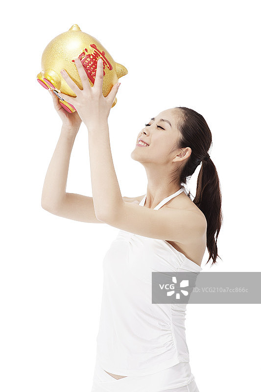 年轻时尚女性和储蓄罐图片素材