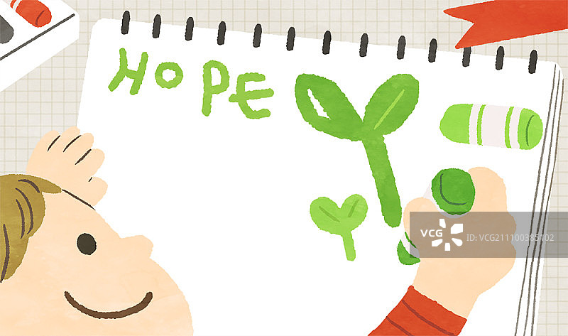 男孩在素描本上画希望之芽图片素材