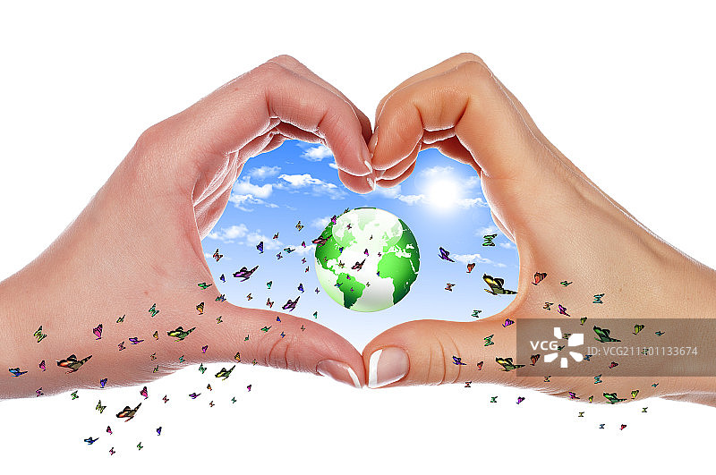 手与彩色蝴蝶、草地和环境标志拼贴图片素材