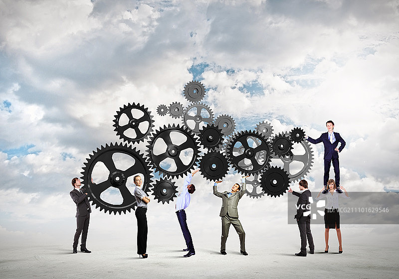 团队合作理念：企业团队协作的概念图。互动与团结图片素材