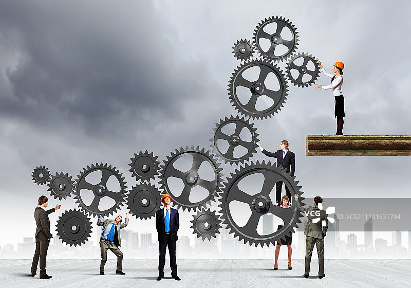 团队合作理念：企业团队协作的概念图。互动与团结图片素材