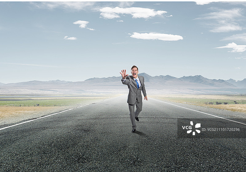 情绪激动奔跑的商人图片素材