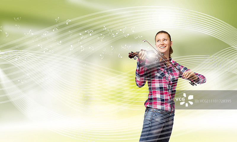 演奏小提琴的年轻女孩图片素材