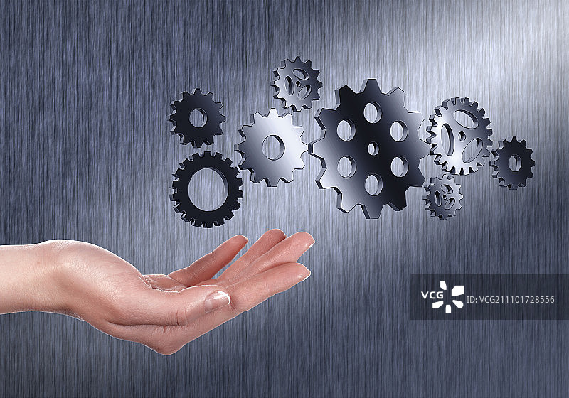 机械齿轮与人手图片图片素材