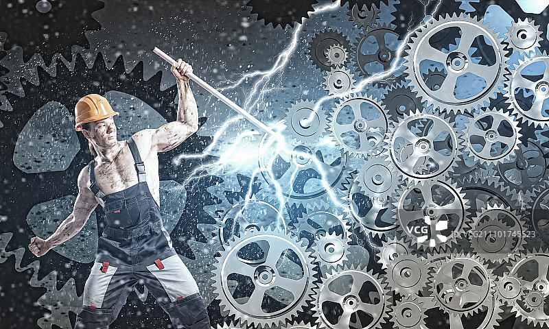 机械师男人：身穿制服的强壮机械师用扳手修理机械图片素材