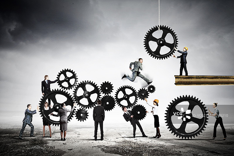 团队合作理念：企业团队协作的概念图。互动与团结图片素材