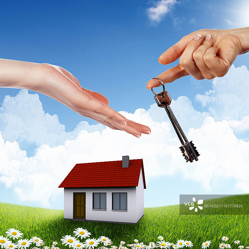 蓝天背景下的房屋和人手图片素材