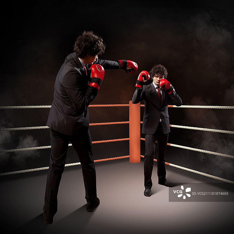 两位年轻男商人拳击概念拼贴图片素材