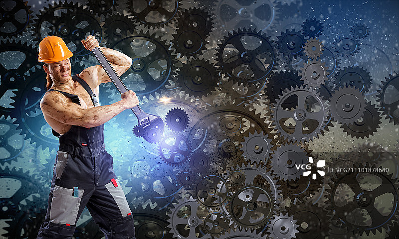 机械师男人：身穿制服的强壮机械师用扳手修理机械图片素材