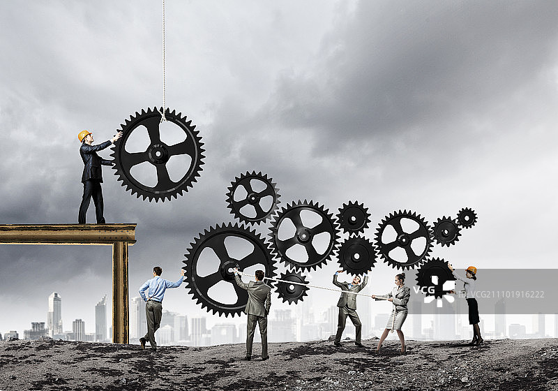 团队合作理念：企业团队协作的概念图。互动与团结图片素材