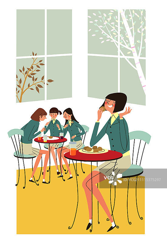 女孩们坐在桌旁吃饼干图片素材