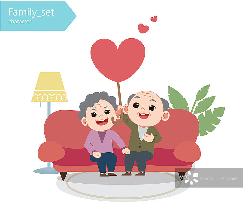 年长的夫妇坐在沙发上，拿着心形棍子图片素材