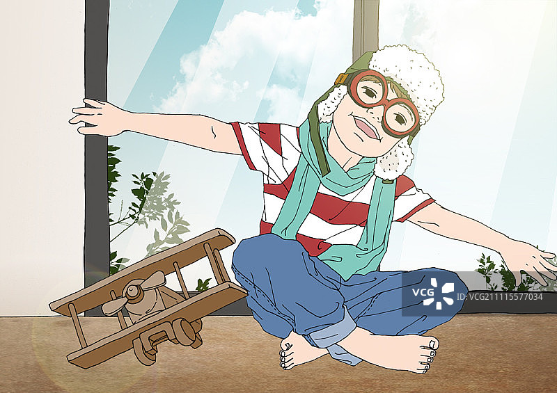 戴护目镜和头盔，拿着玩具飞机的男孩图片素材