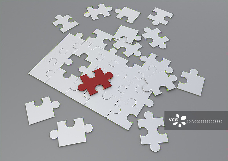 白色拼图中的红色拼图图片素材