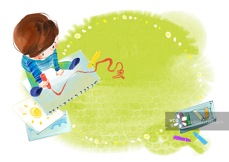 男孩用蜡笔在写生簿上绘画图片素材
