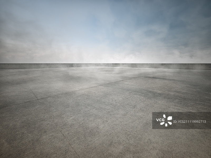雾中的开放式混凝土停车场图片素材