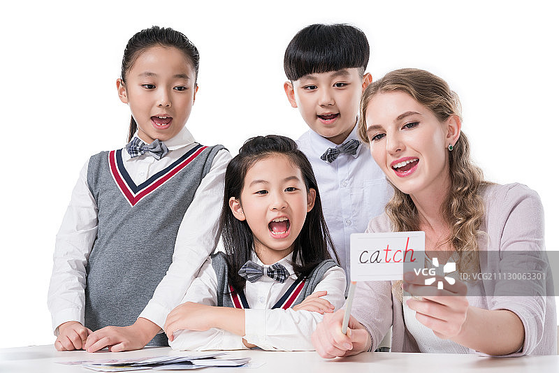 女外教指导小学生学习图片素材