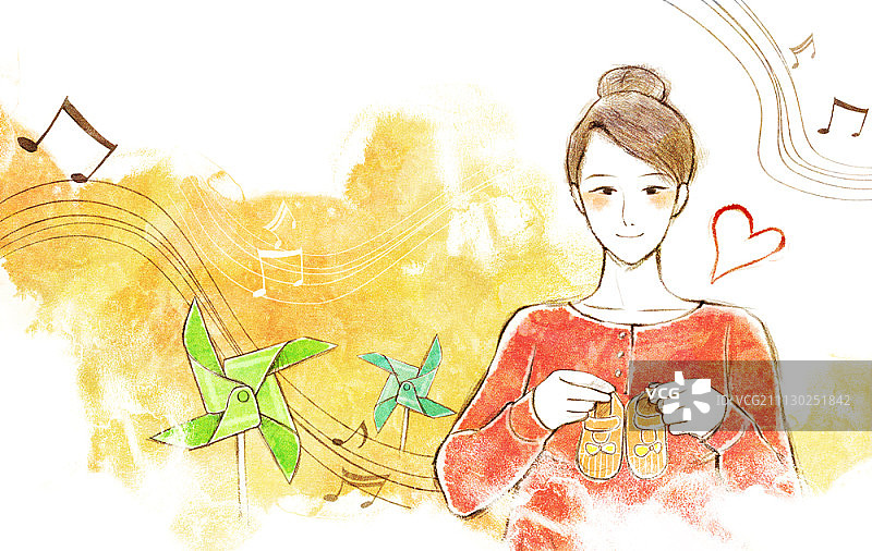 孕妇拿着婴儿鞋图片素材