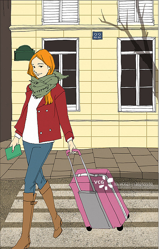 女子拖着行李箱在城市中行走图片素材