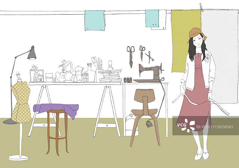 女人在工作室手拿卷尺图片素材