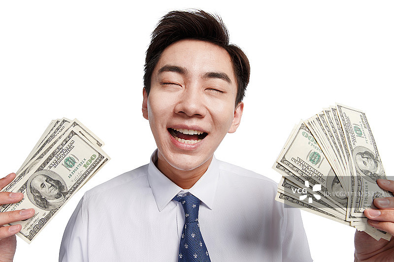 商务青年男人拿着美元图片素材