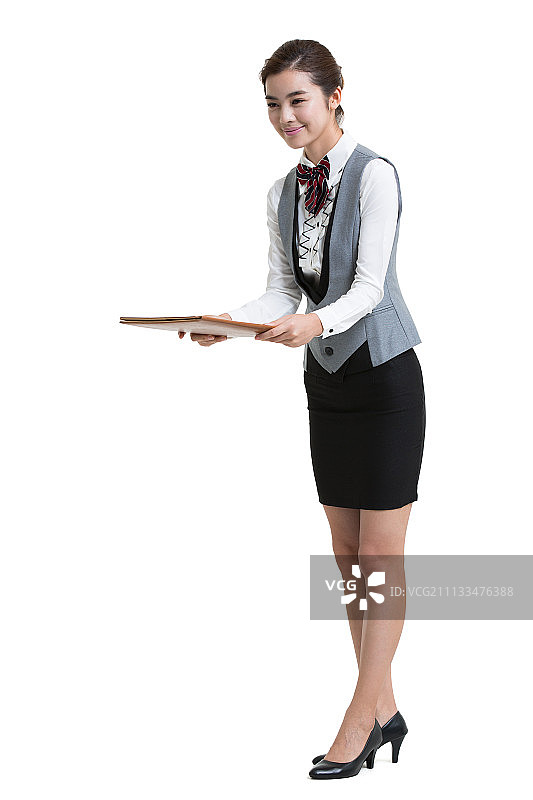 酒店微笑女服务生手拿菜单图片素材