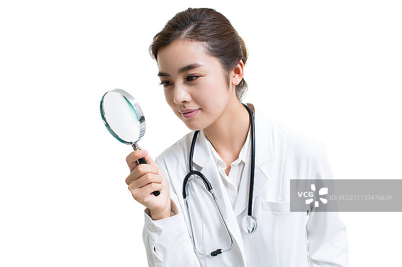 年轻女医生使用放大镜图片素材