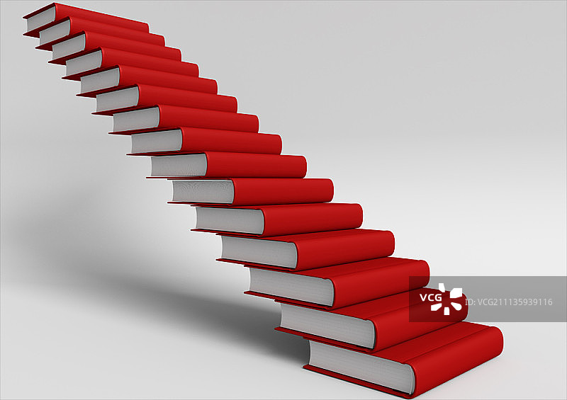 红色封面书籍堆叠成阶梯图片素材