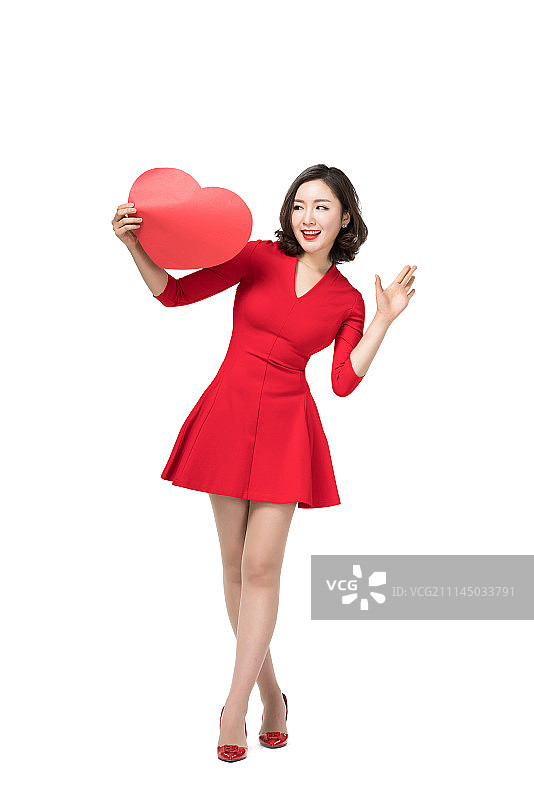 身穿红色连衣裙的年轻女子图片素材