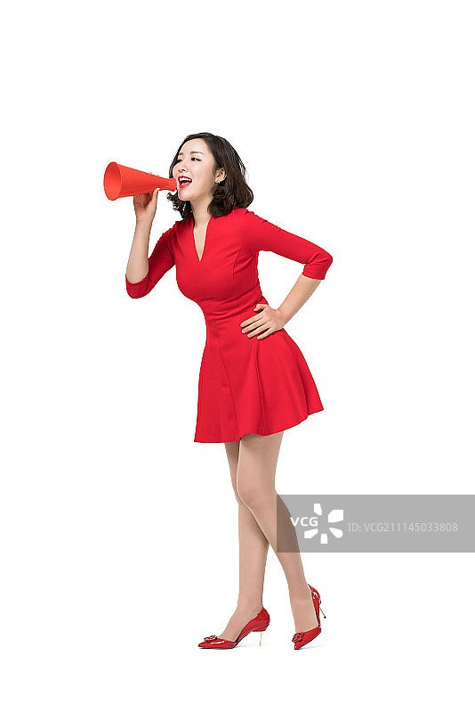 身穿红色连衣裙的年轻女子图片素材