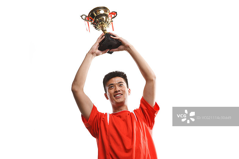运动员高举奖杯图片素材