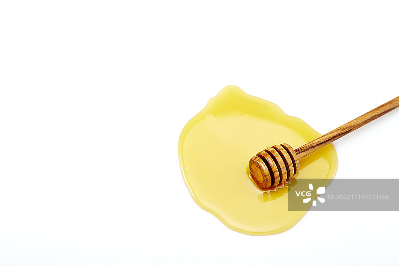 蜂蜜和蜂蜜勺摄影图片素材