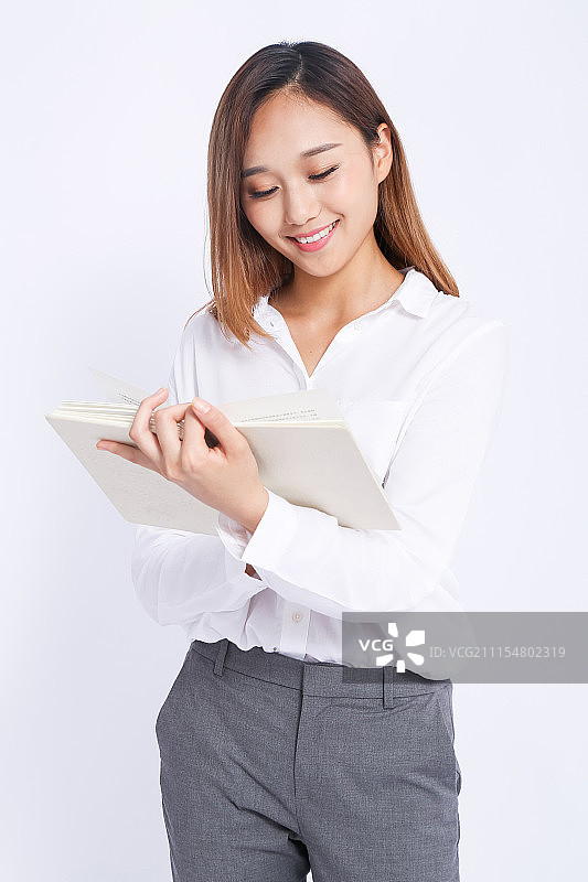 做笔记的职业女性图片素材