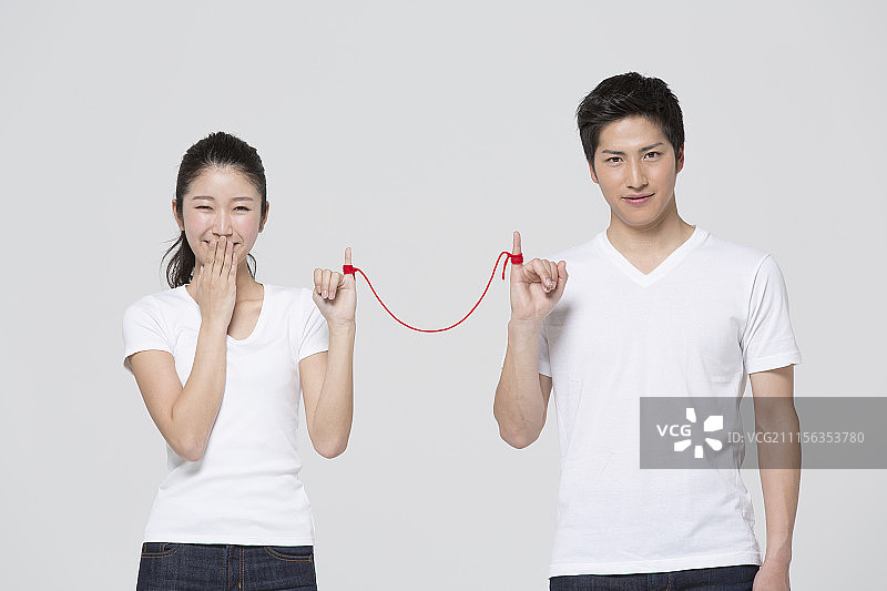 情侣用细线连接小指的摄影照片图片素材