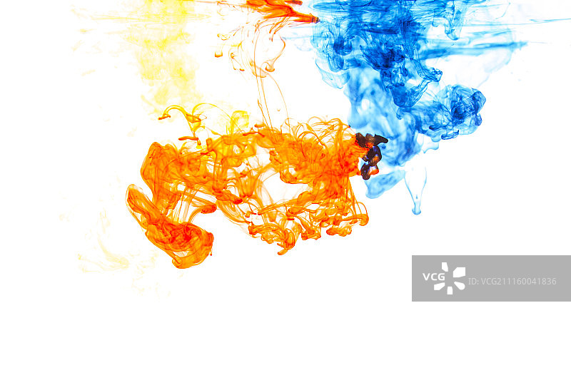 蓝色和桔色墨水在水中图片素材