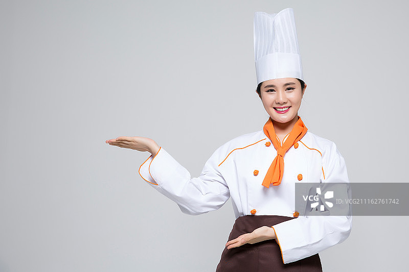 厨师、厨师或面包师在空白处展示手势女厨师，白色背景图片素材