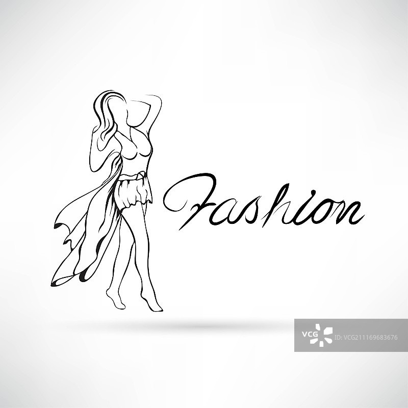 在T台上走秀，展示礼服的美丽女模特图片素材