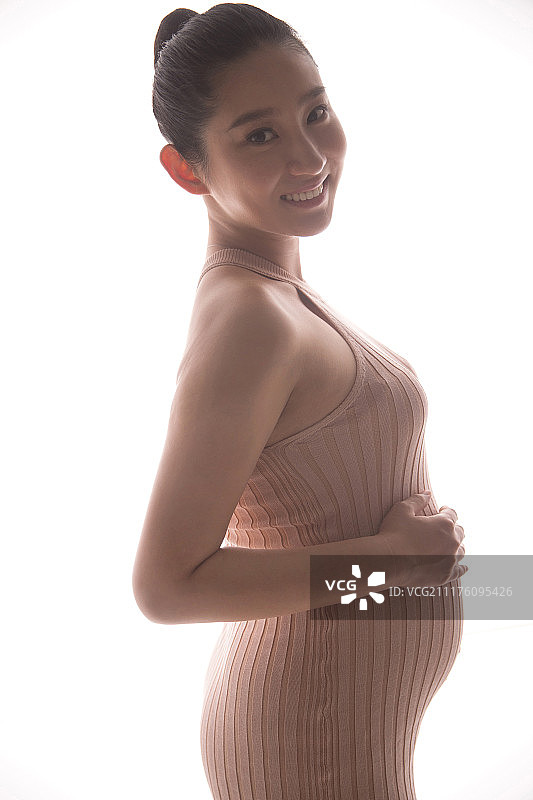 孕妇抚摸肚子图片素材