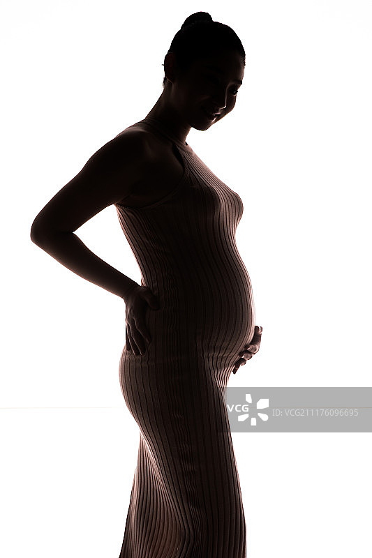 孕妇抚摸肚子图片素材