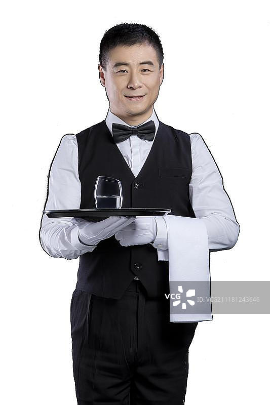 托着杯子的男招待图片素材