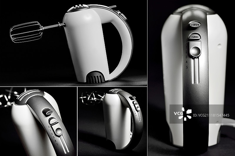 黑色背景上的厨房手持搅拌机图片素材