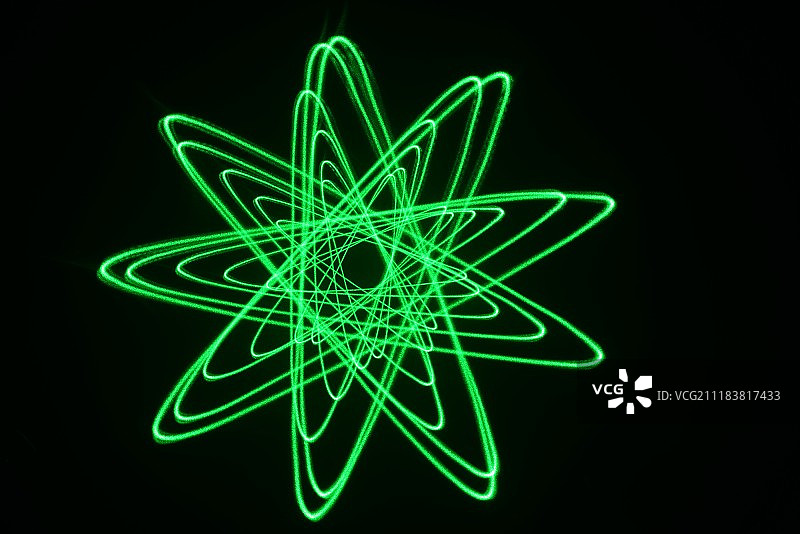 绿色激光光绘物理图案黑色背景棚拍创意图片素材