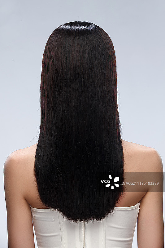 年轻女人亮丽丝缎般的头发图片素材