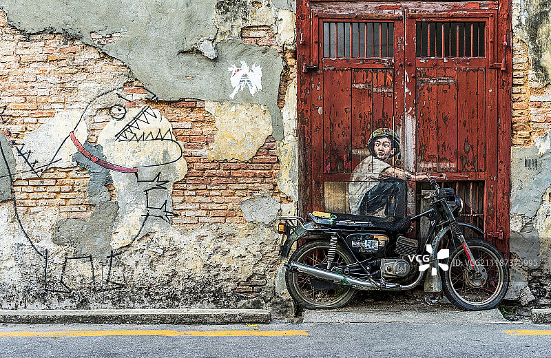 马来西亚槟城乔治市老城街头的涂鸦壁画图片素材