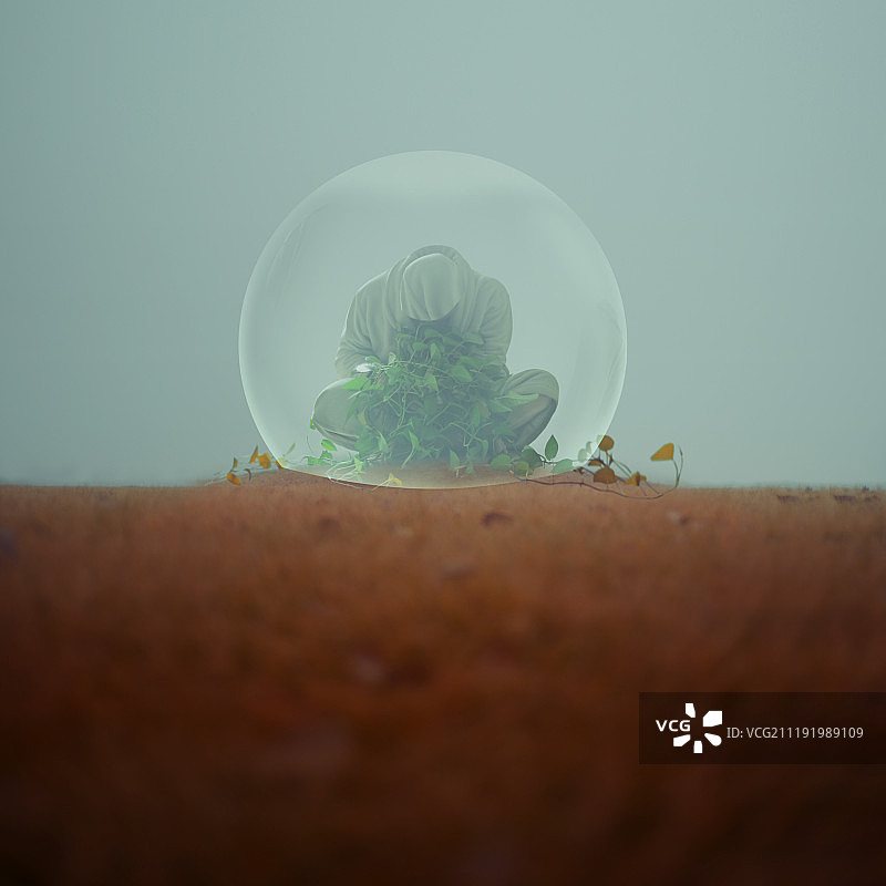 被玻璃罩保护的人和植物图片素材